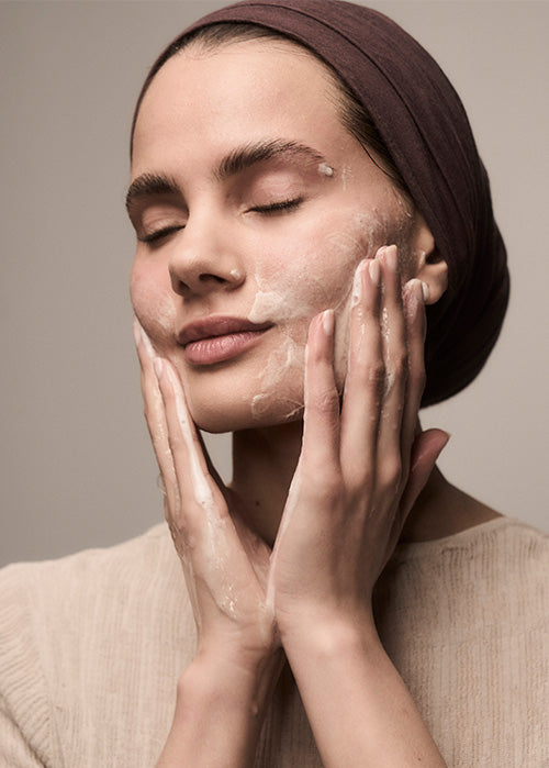 Rising Tides Facial Cleanser on woman's face